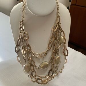 Multi-strand gold necklace with glass beads. Claw closure and extension.